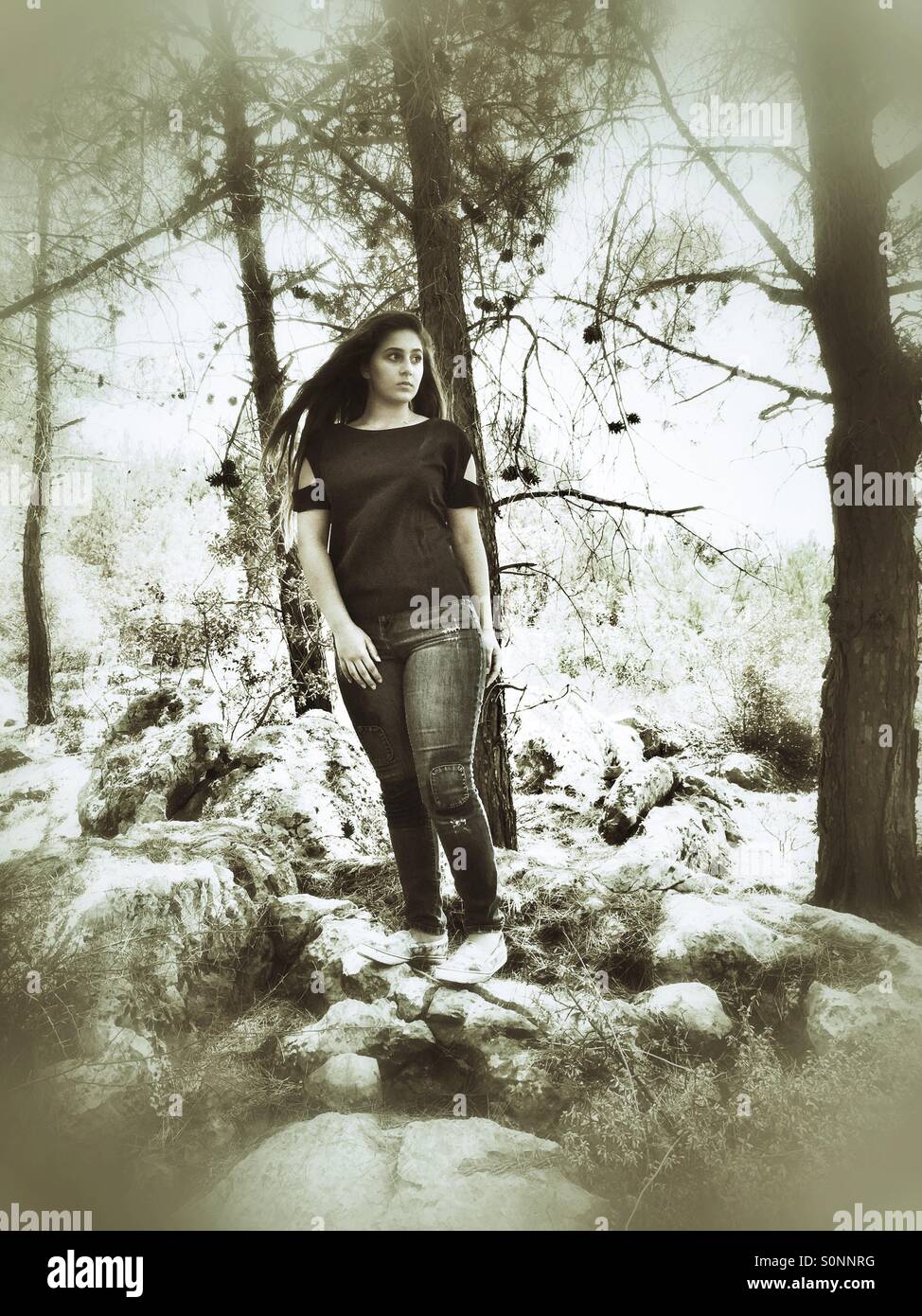 Teenage girl in the woods Stock Photo