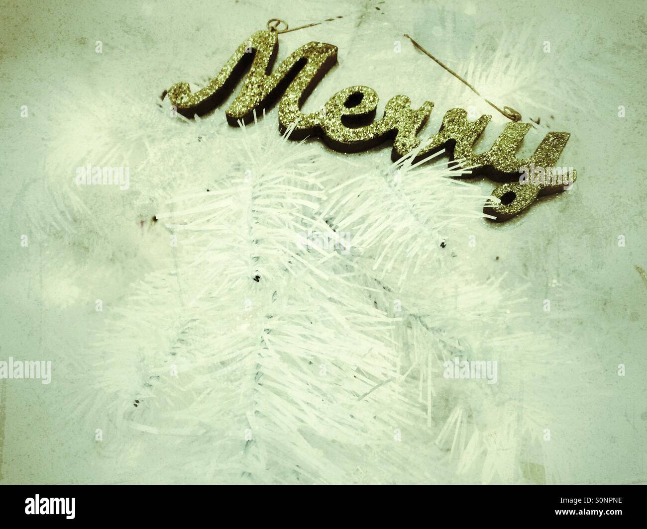 Word MERRY in cursive and with gold glitter - Smartphone Captured Stock Image
