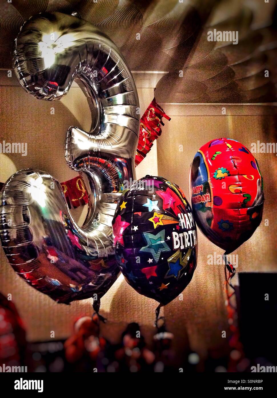 Birthday balloons for a 3rd birthday. - Smartphone Captured Stock Image