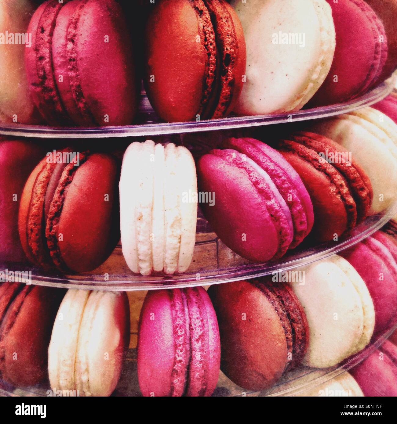 Chocolate Vanilla and Raspberry Macaroons on a cake stand - Smartphone Captured Stock Image