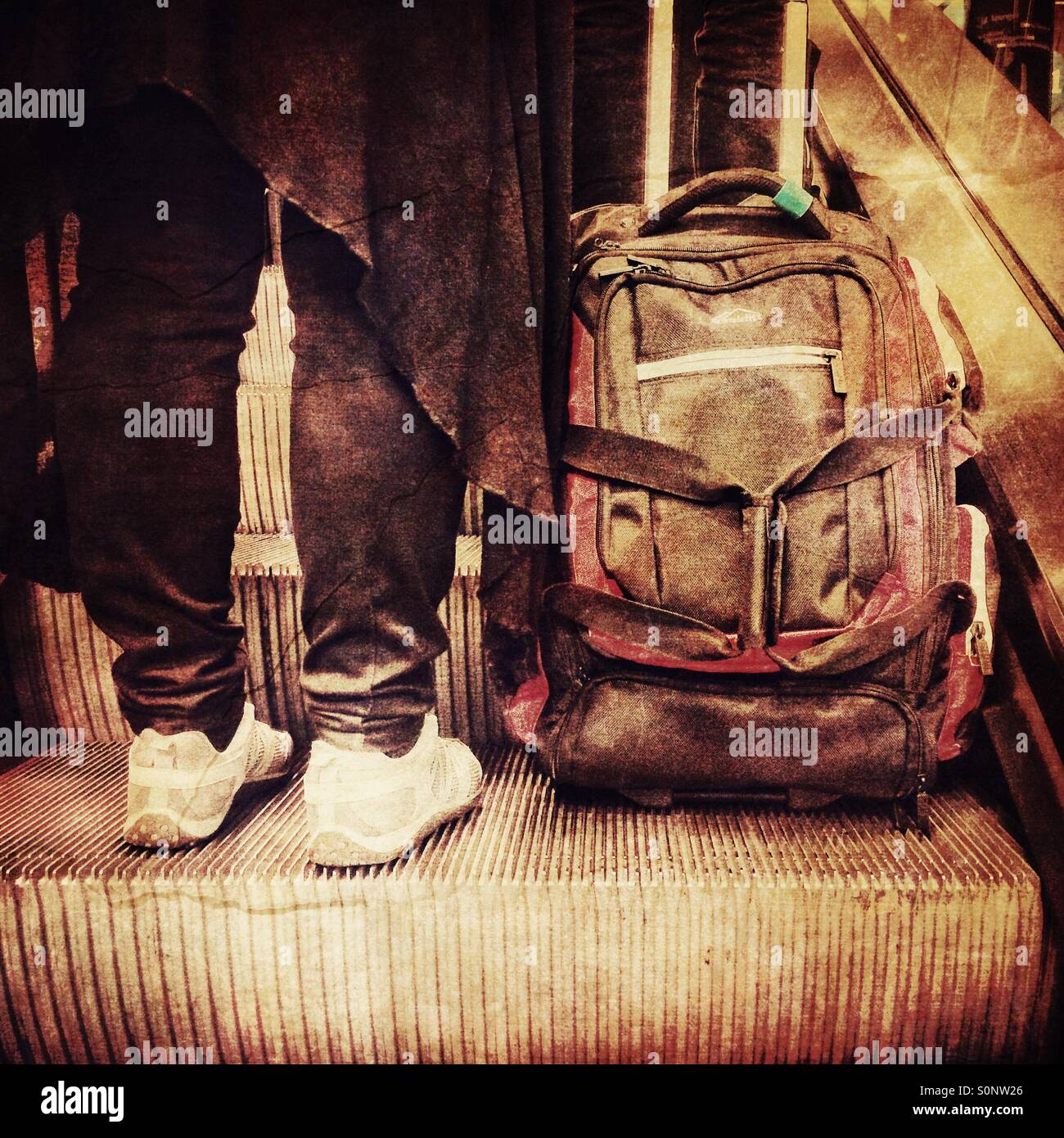 Person with bag on escalator - Smartphone Captured Stock Image