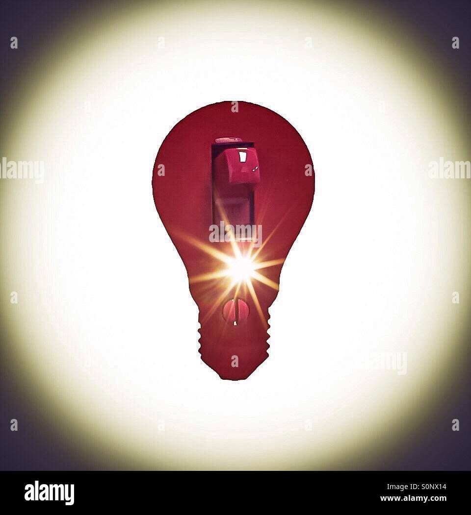 Red switch shaped like an incandescent bulb with a flare, Nova Scotia, Canada. Concepts: point of light, spark, alert, innovation. Old fashioned. From another era. - Smartphone Captured Stock Image