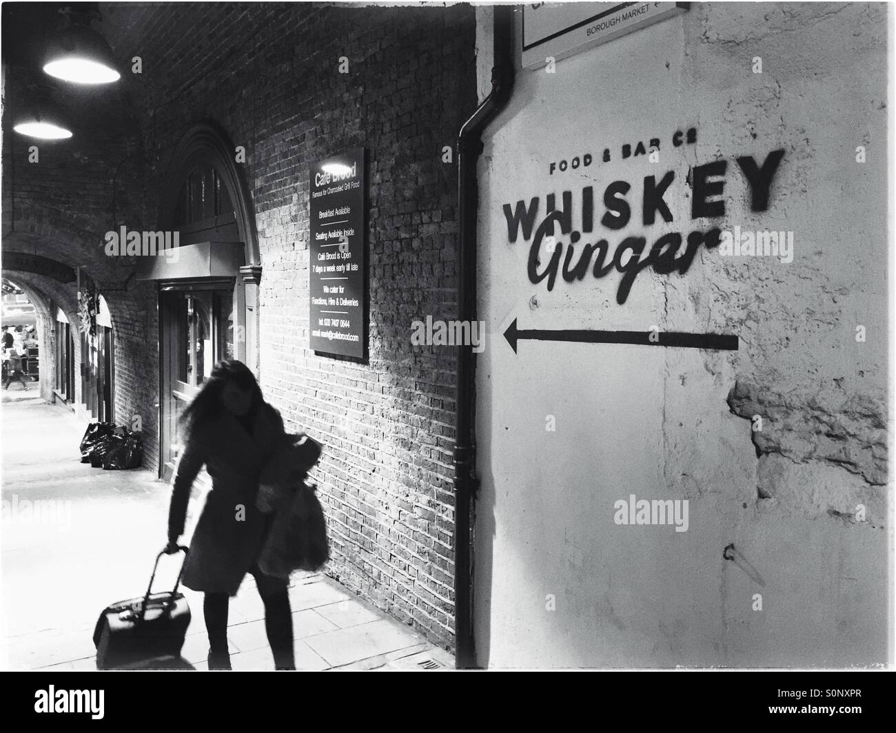 Woman  dragging luggage,London,England - Smartphone Captured Stock Image
