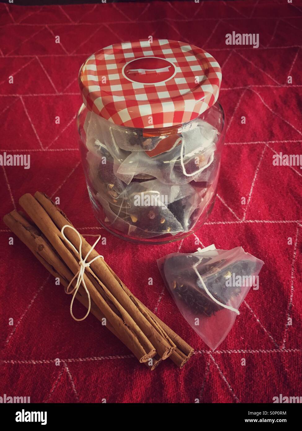 Jar of spiced Christmas tea with cinnamon sticks - Smartphone Captured Stock Image