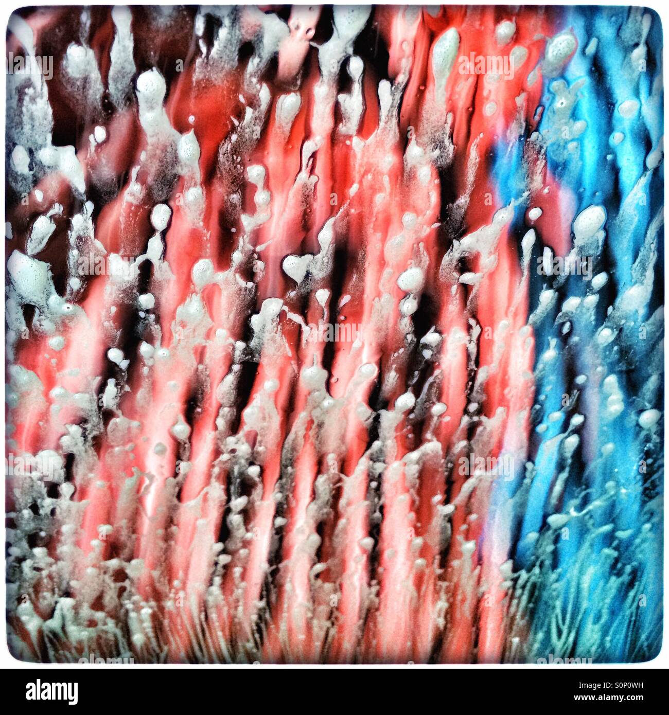 Soap suds on windscreen in carwash. - Smartphone Captured Stock Image