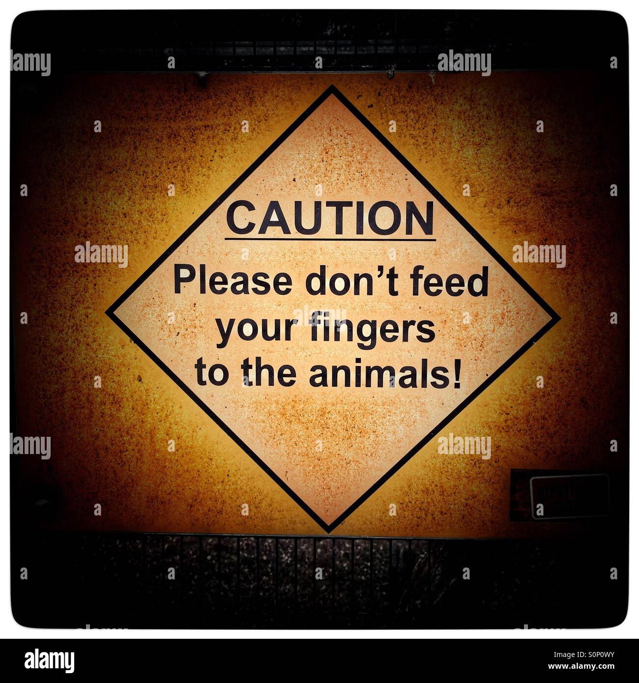Warning sign at zoo. - Smartphone Captured Stock Image