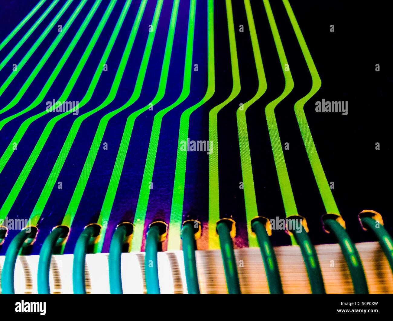 Ring binder with a twist. Bending lines create the illusion of a fold in the cover  and give it a non-linear look. - Smartphone Captured Stock Image