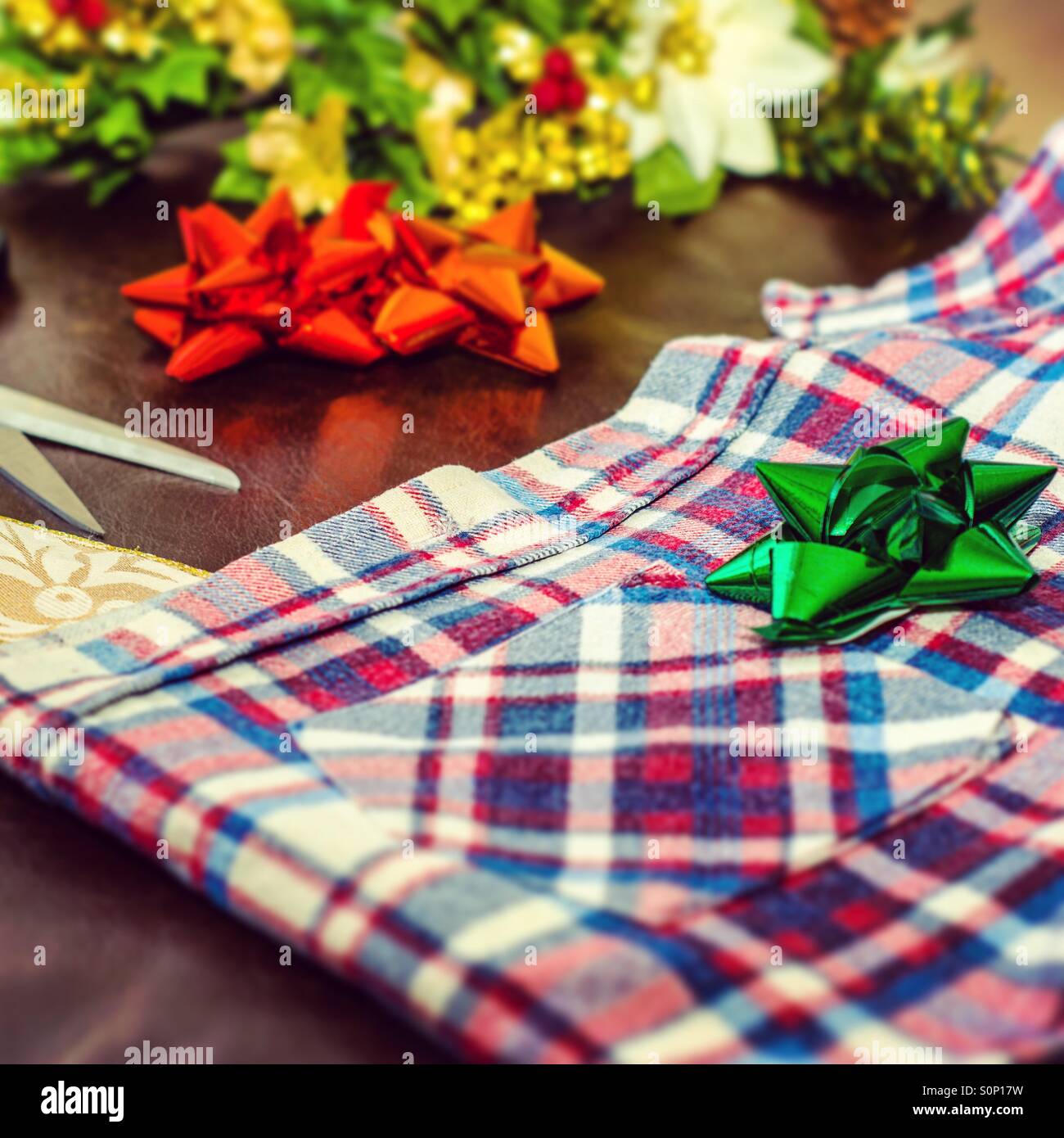 Christmas gift wrapping a man's shirt - Smartphone Captured Stock Image