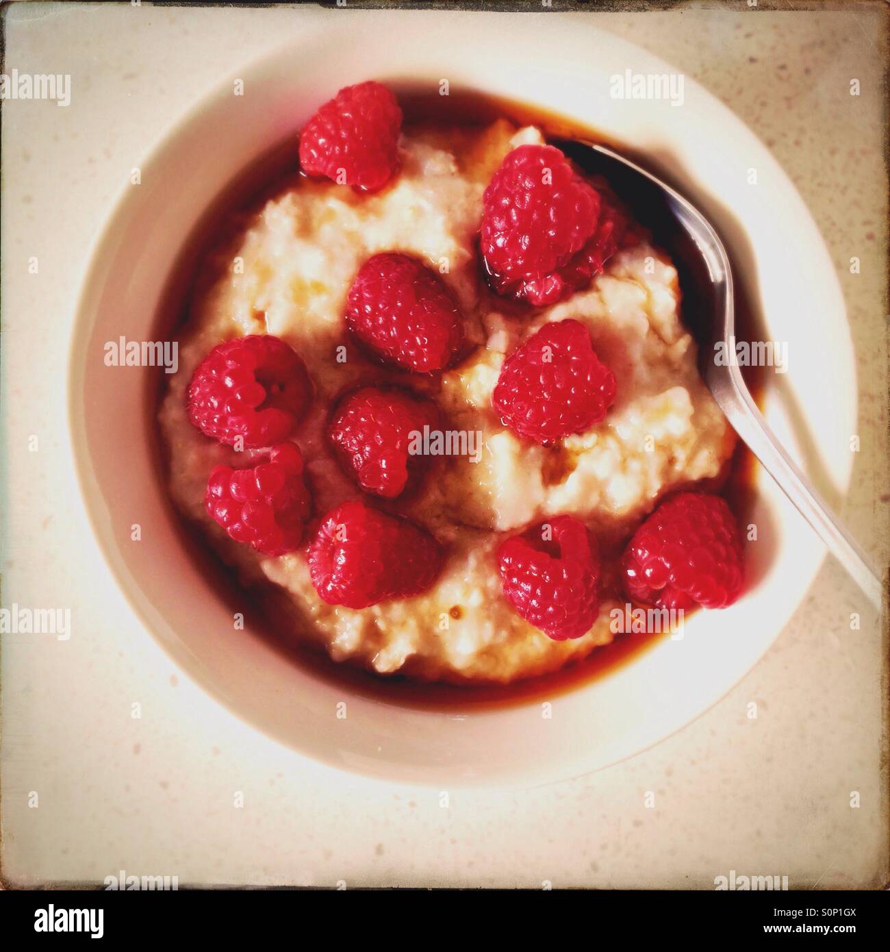 Porridge with fresh raspberries and maple syrup - Smartphone Captured Stock Image