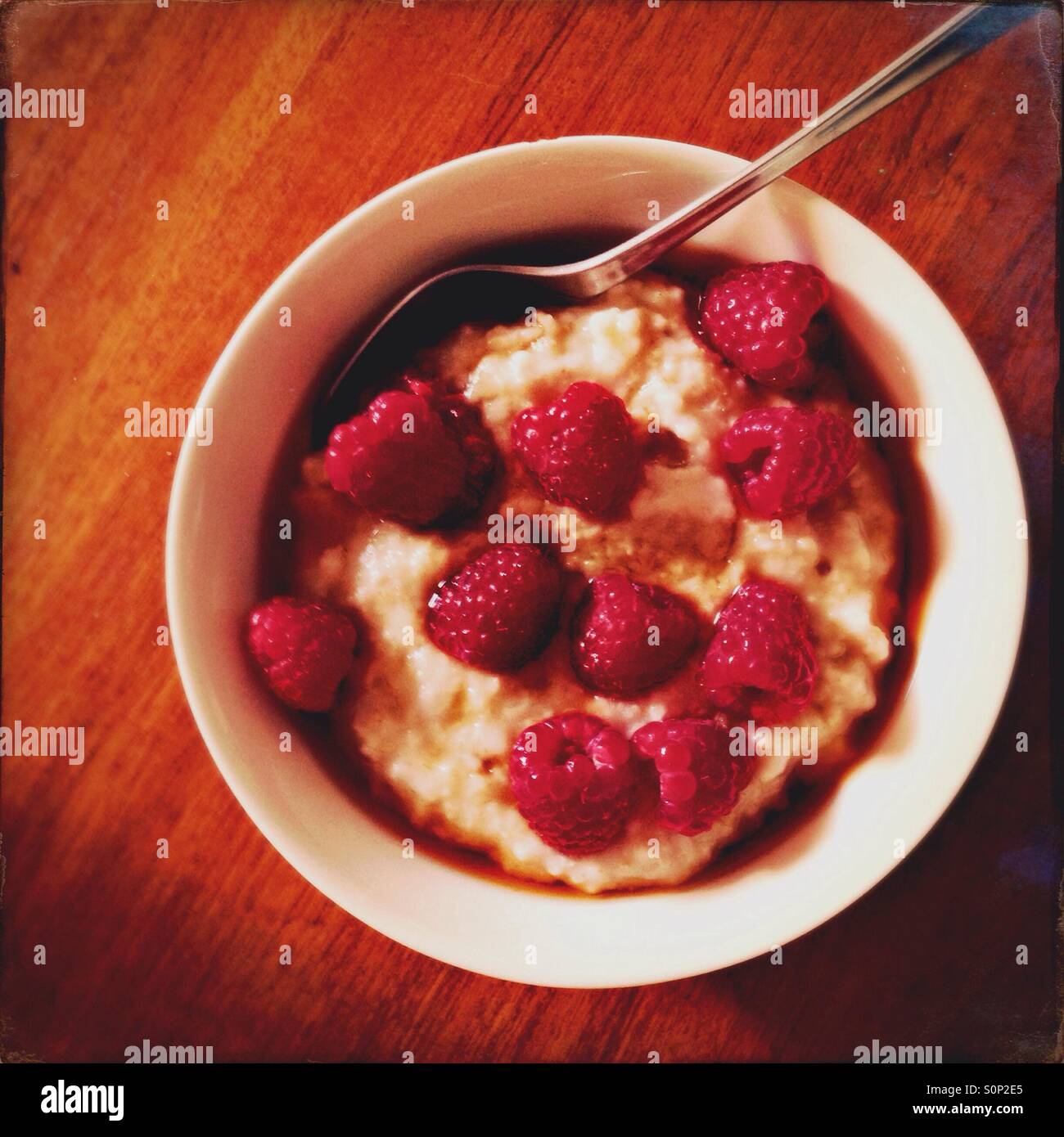 Porridge with fresh raspberries and maple syrup - Smartphone Captured Stock Image