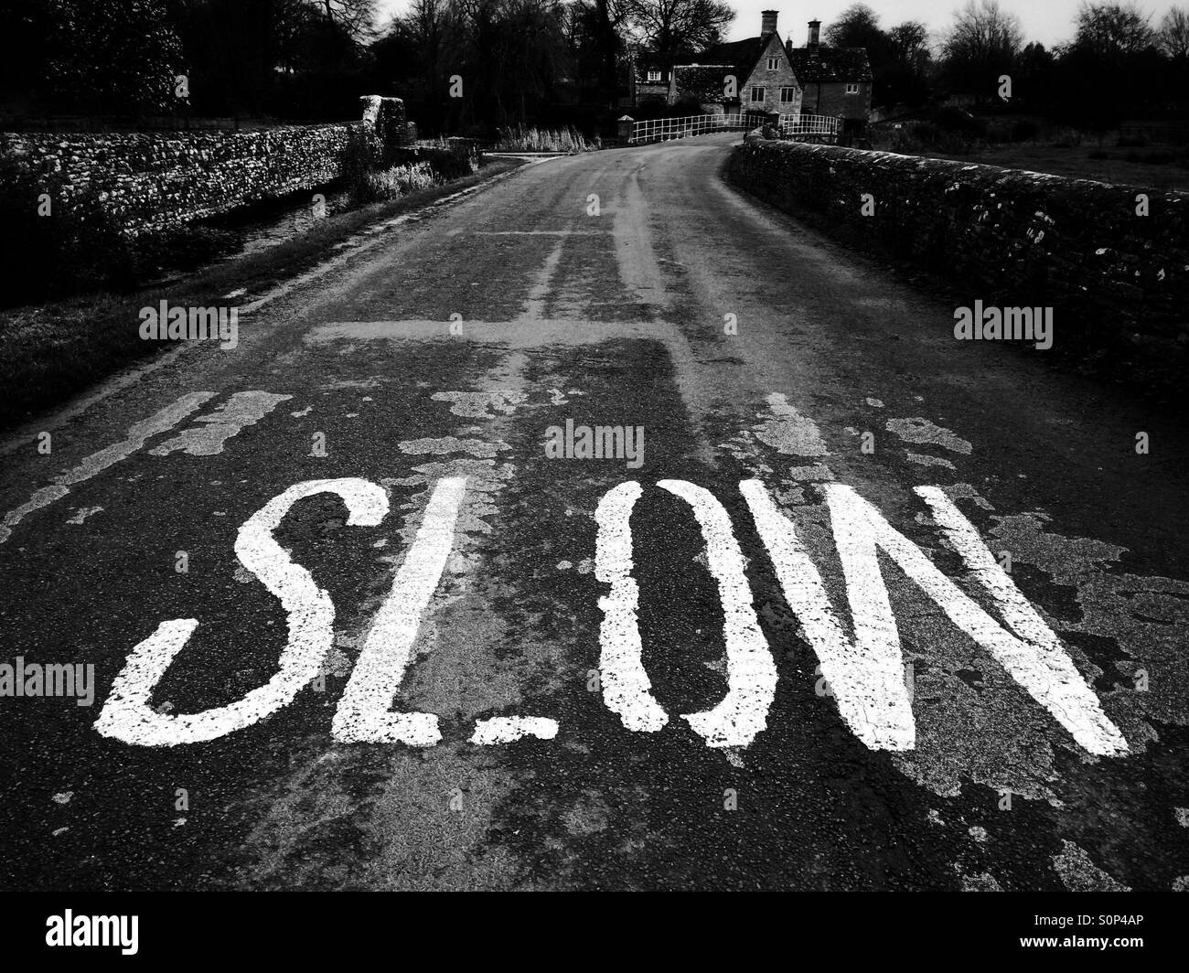Slow warning sign on a country road in the Cotswolds UK - Smartphone Captured Stock Image