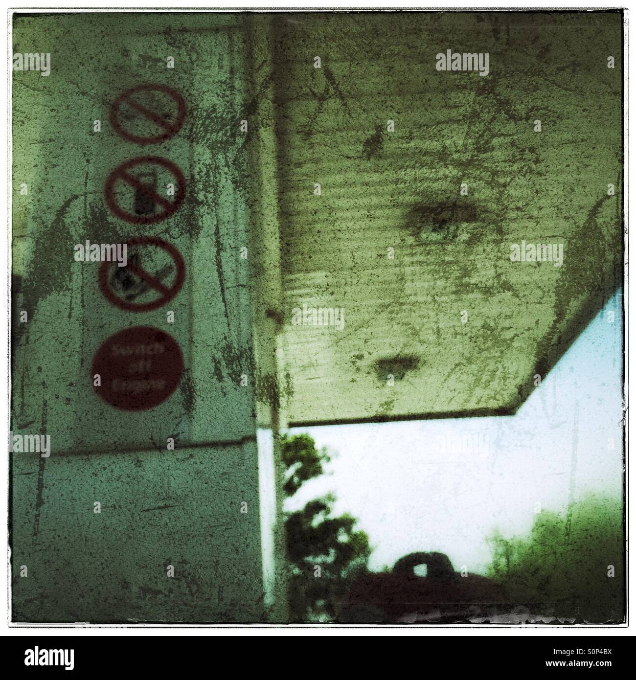 Public safety signs at petrol station. - Smartphone Captured Stock Image