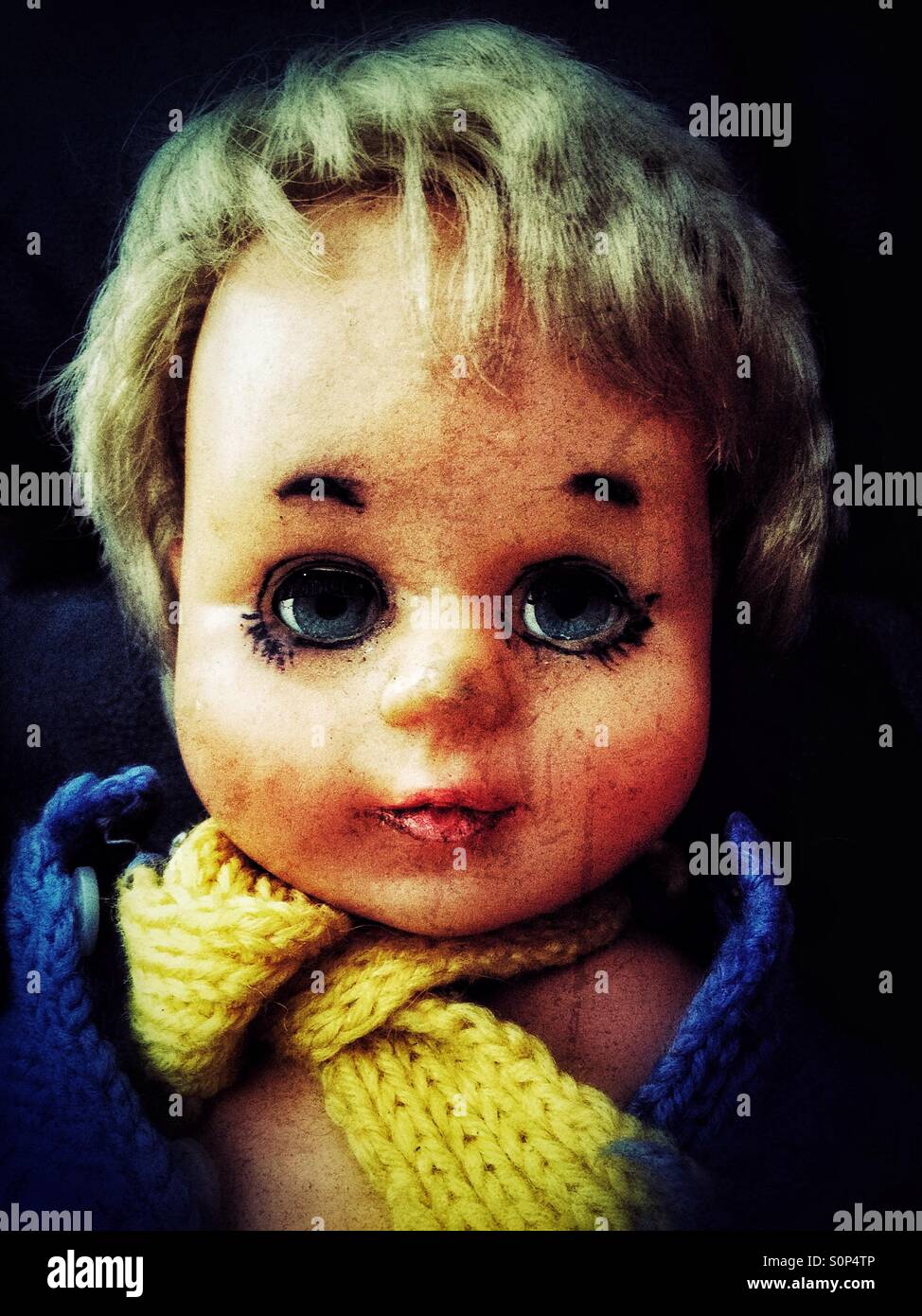 Sad looking baby doll Stock Photo