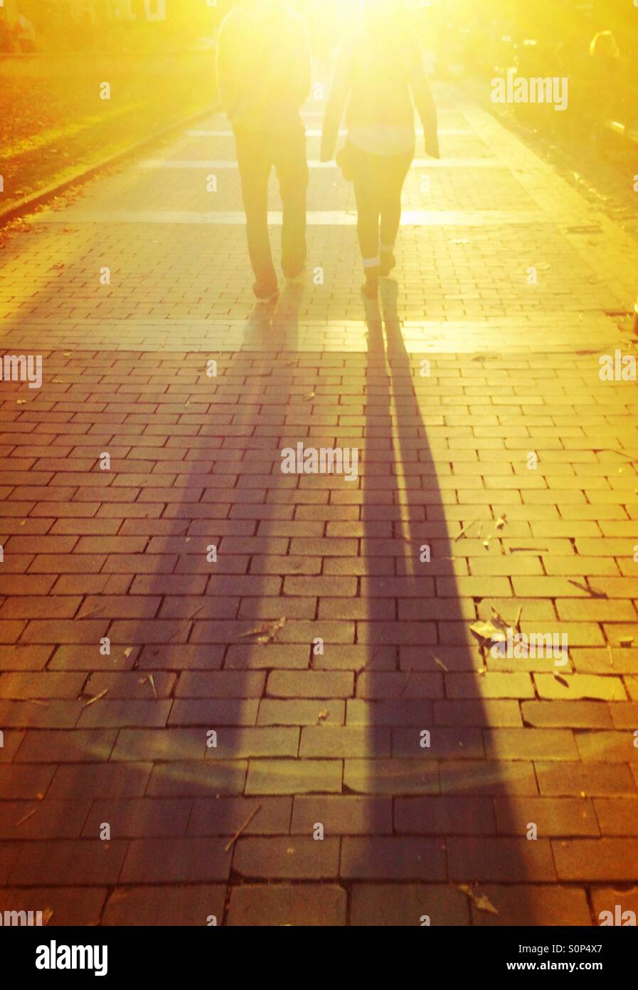 Couple walking though Rittenhouse Square, Philadelphia - Smartphone Captured Stock Image
