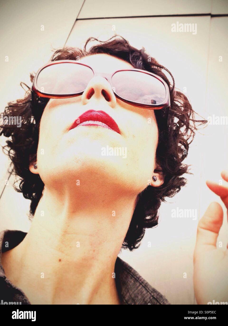 Woman wearing sunglasses hi-res stock photography and images - Alamy