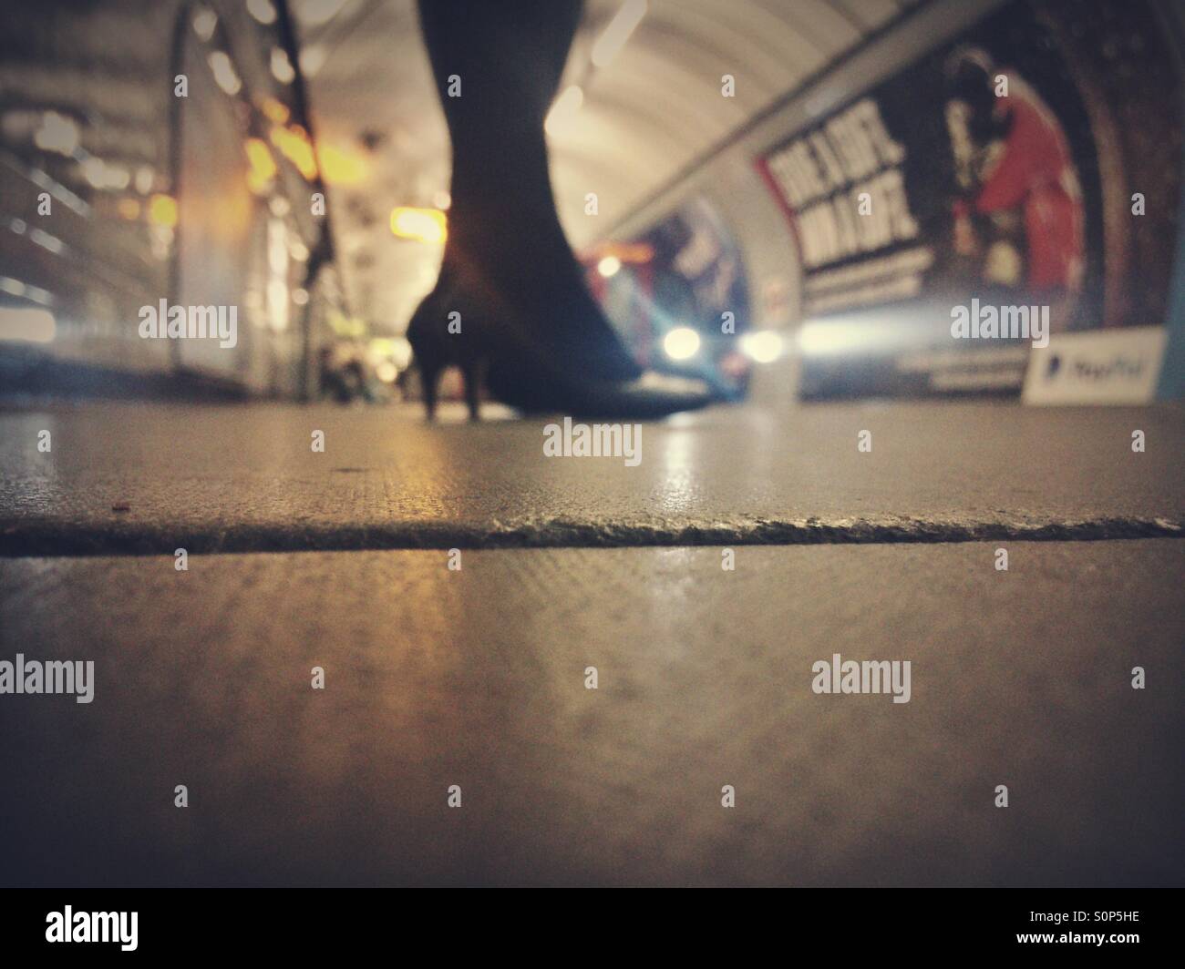 Waiting on an underground station platform - Smartphone Captured Stock Image