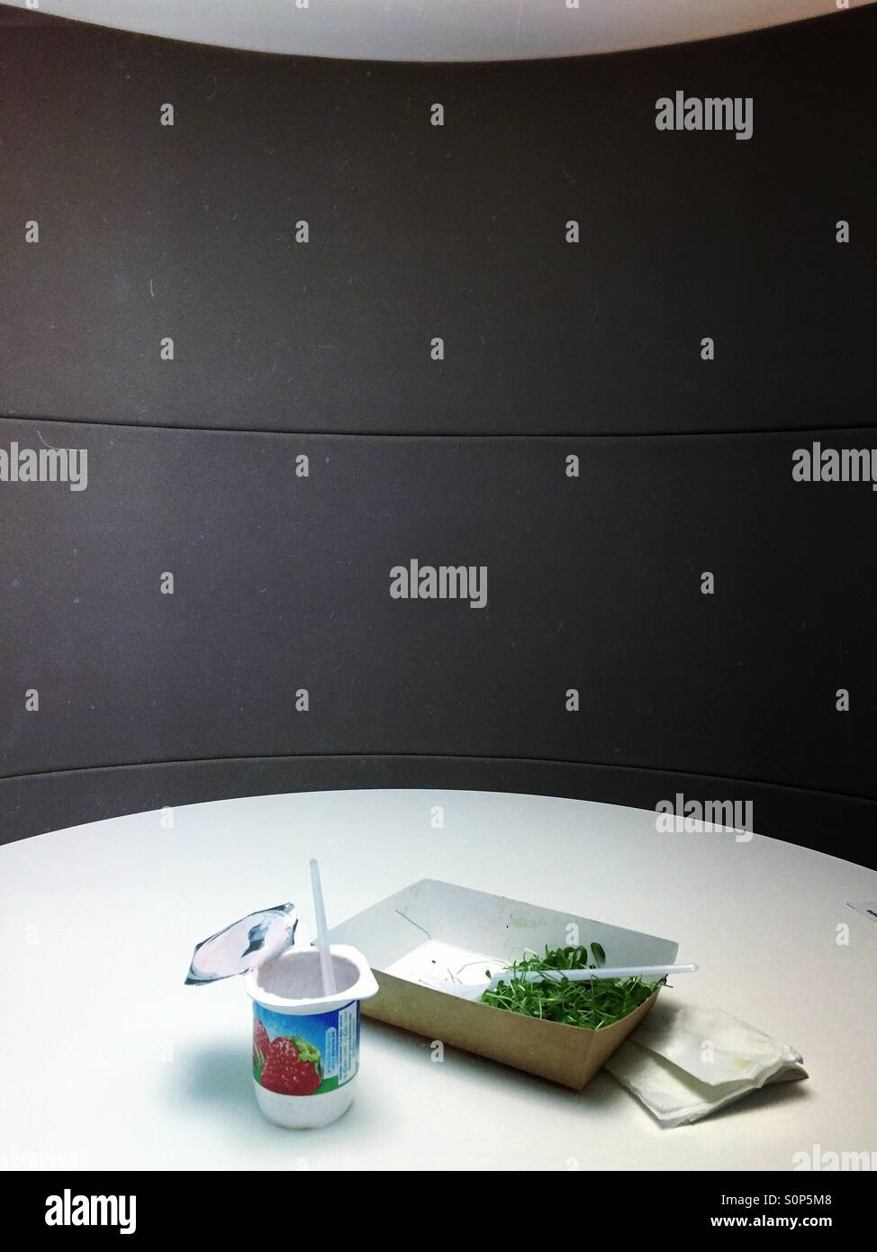 Lunch alone in the office - Smartphone Captured Stock Image