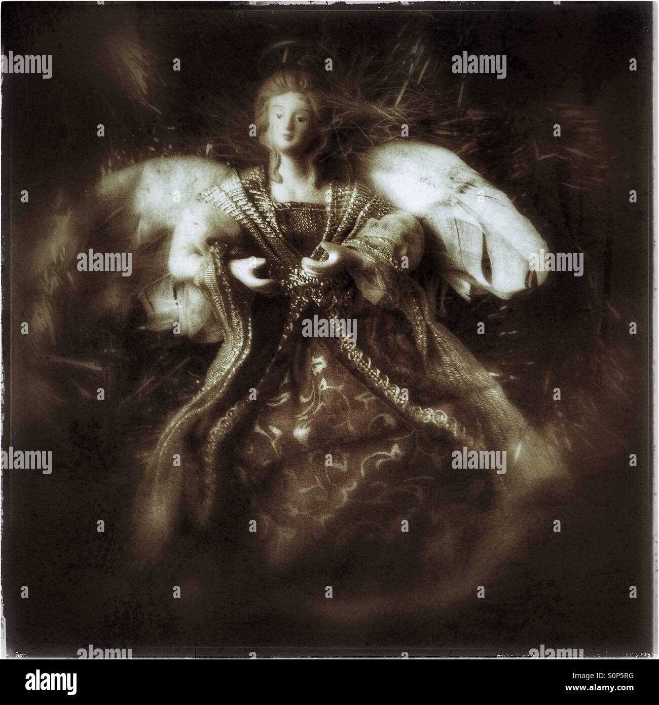 Vintage Christmas tree angel with tinsel. Stock Photo