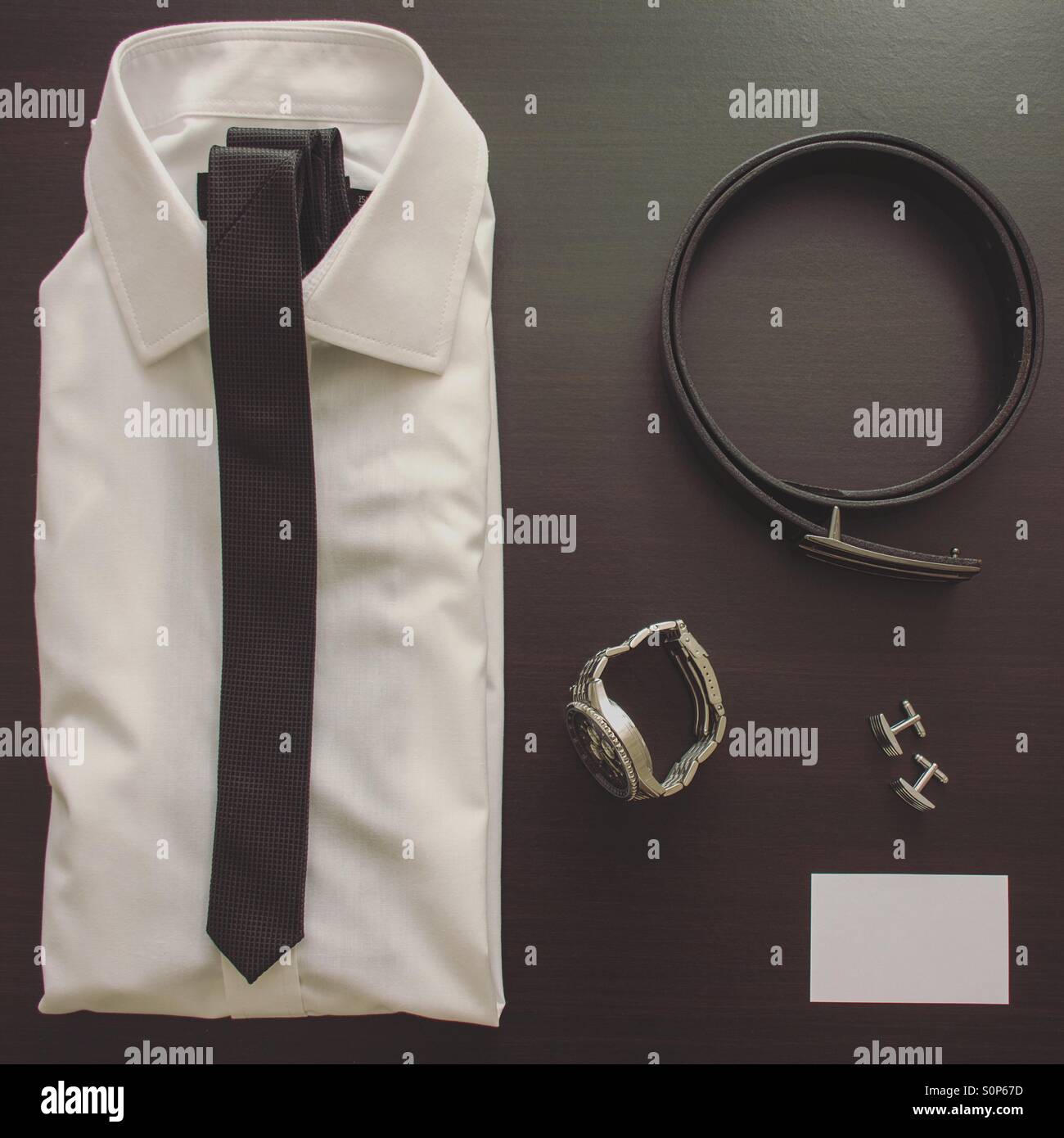 Business mans clothing and accessories with copy space in a blank business card - Smartphone Captured Stock Image
