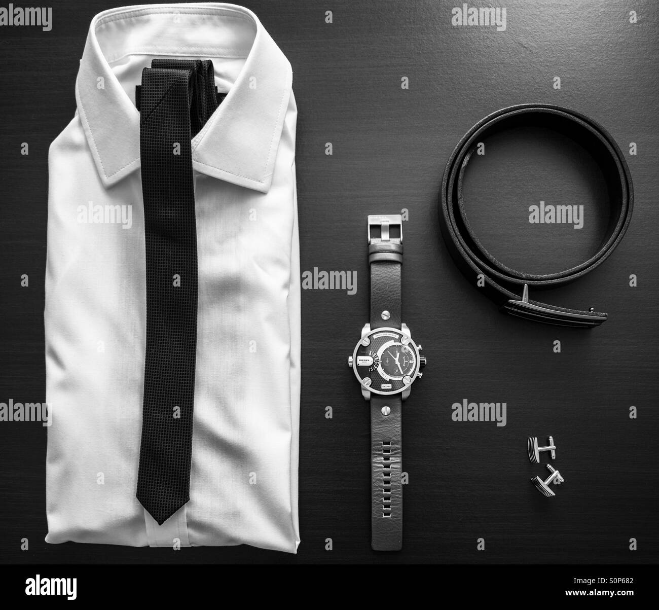 Men's designer clothing and accessories. Overhead shot with filtered black and white effect. - Smartphone Captured Stock Image