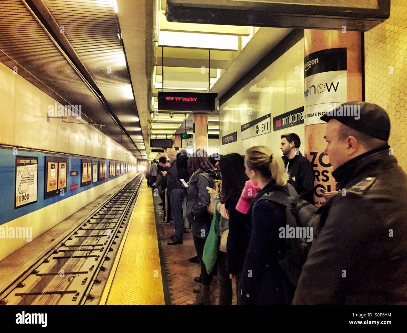 San Francisco Metro passengers awaiting the next outbound MUNI train - Smartphone Captured Stock Image