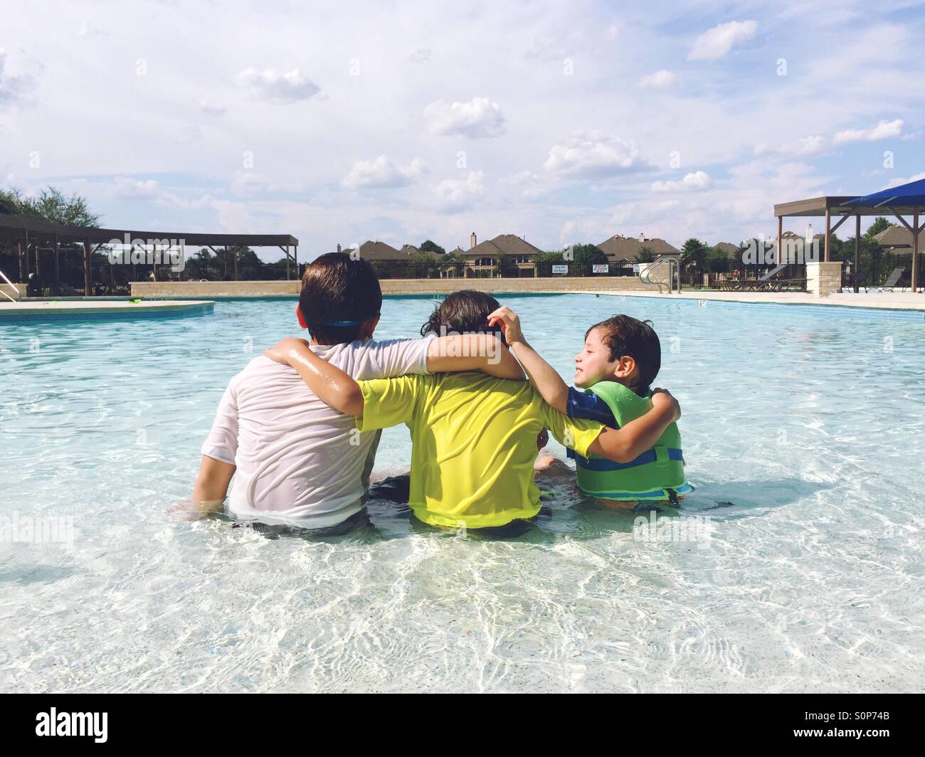 Brothers in swimming pool. Stock Photo