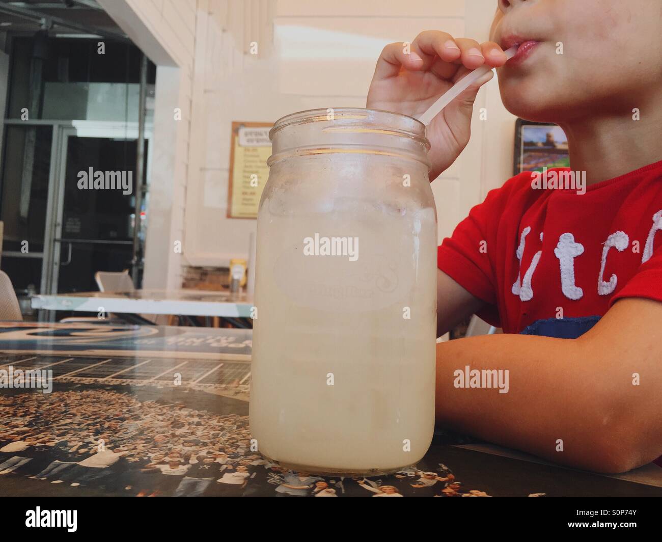 Boy drinking lemonade. Stock Photo