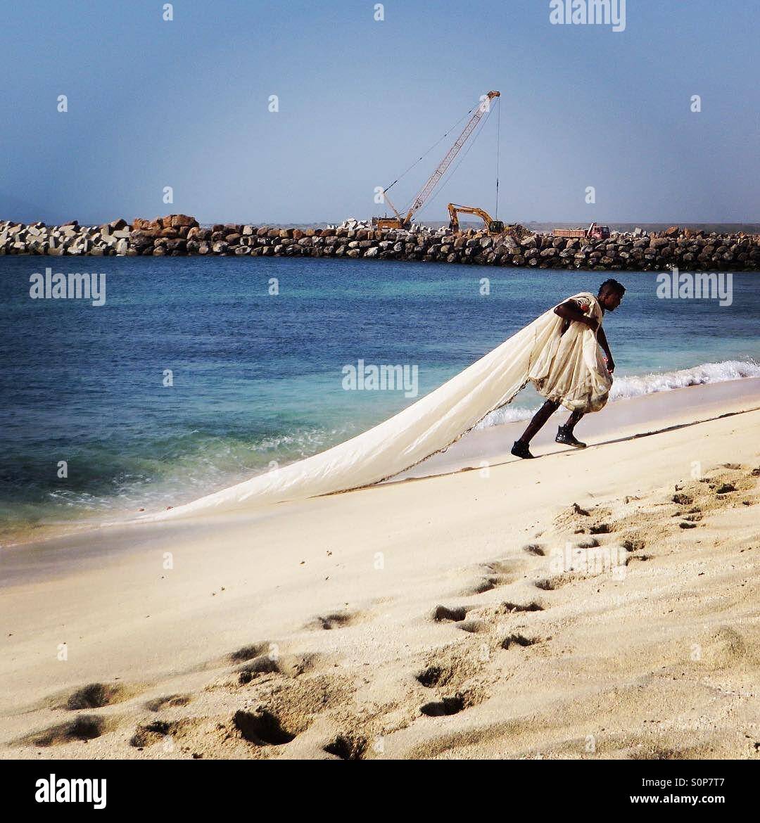 Fisherman dragging in a catch in the net Cape Verde - Smartphone Captured Stock Image