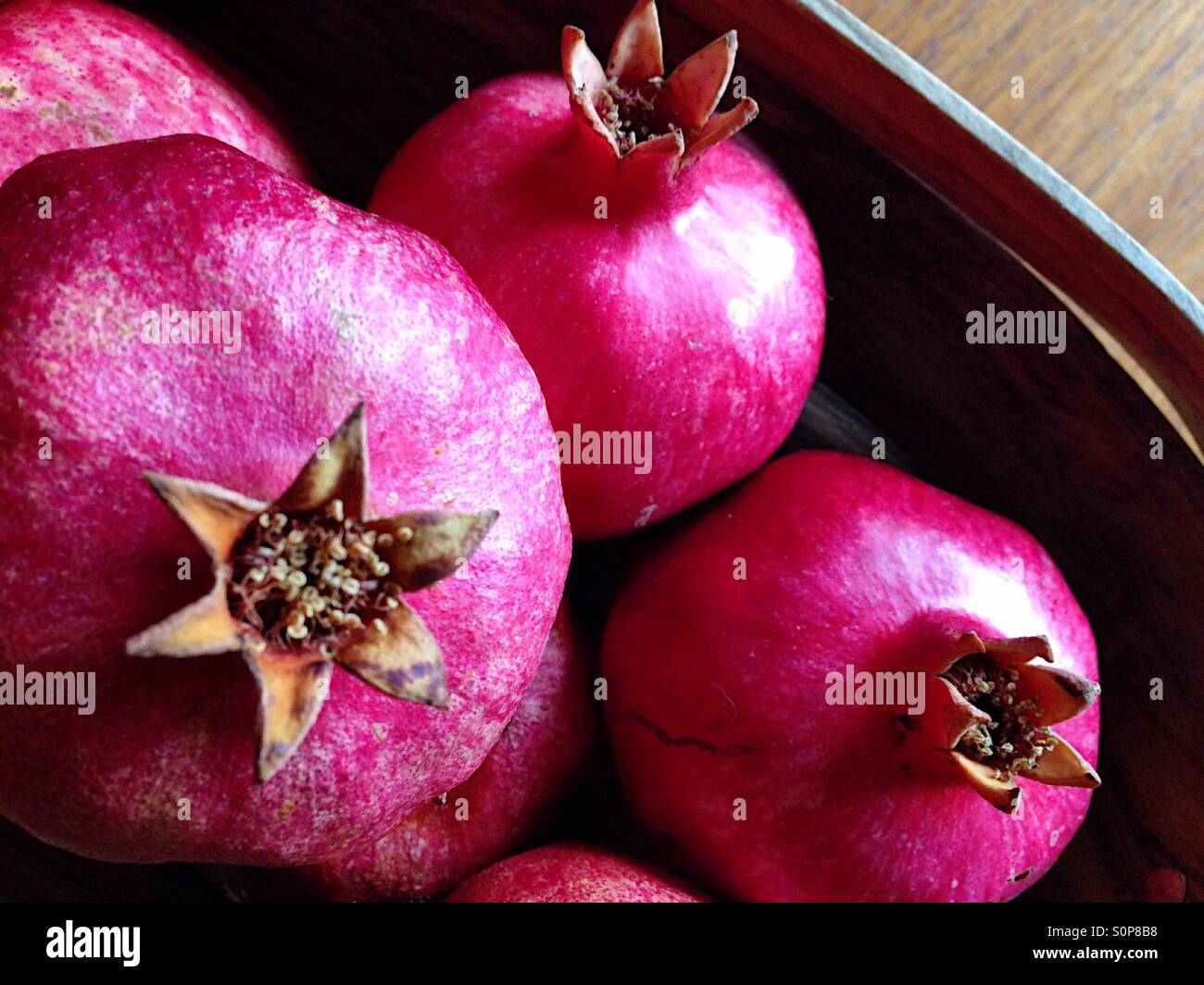 Ripe pomegranates in a basket - Smartphone Captured Stock Image