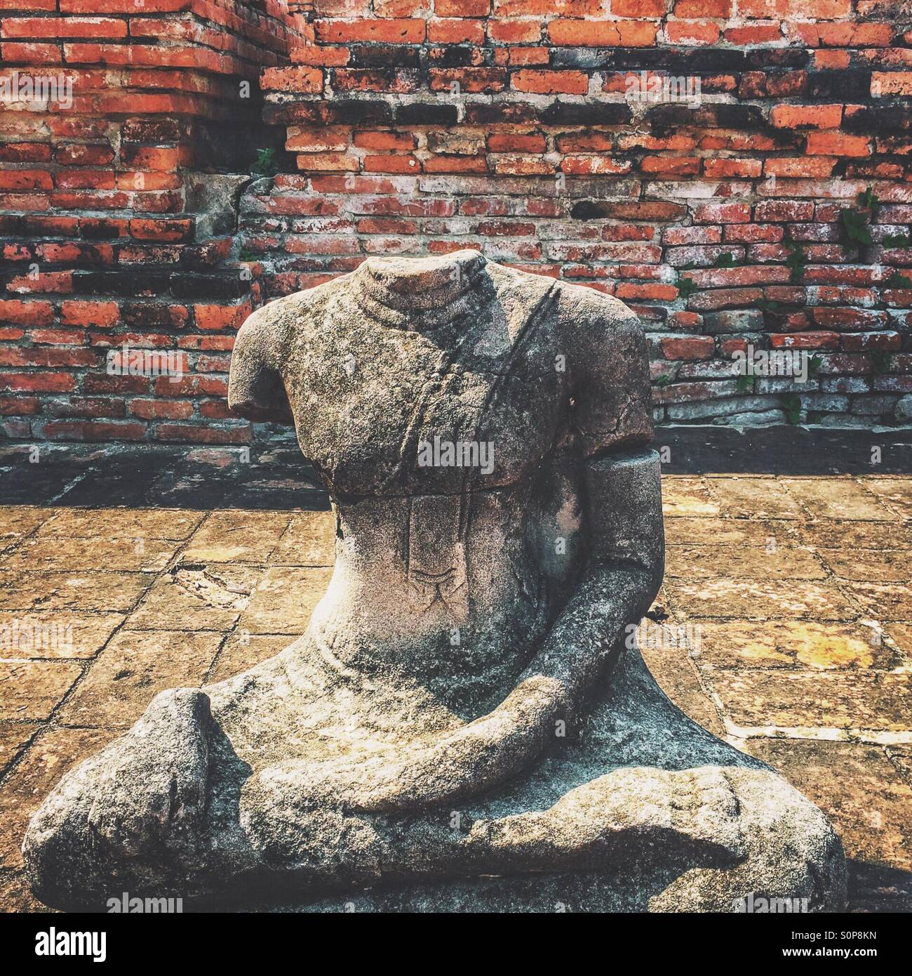 Damaged Buddha statue at Wat Mahathat, Ayutthaya, Thailand - Smartphone Captured Stock Image