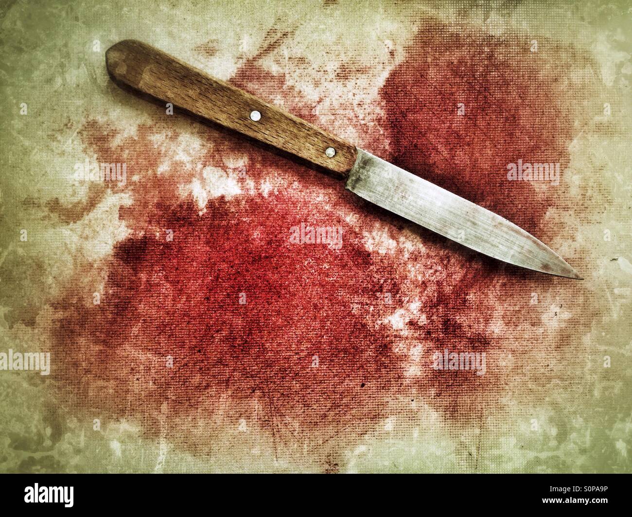 Remains of a slaughtered beetroot: red beetroot juice on a plastic cutting board looking like blood - Smartphone Captured Stock Image