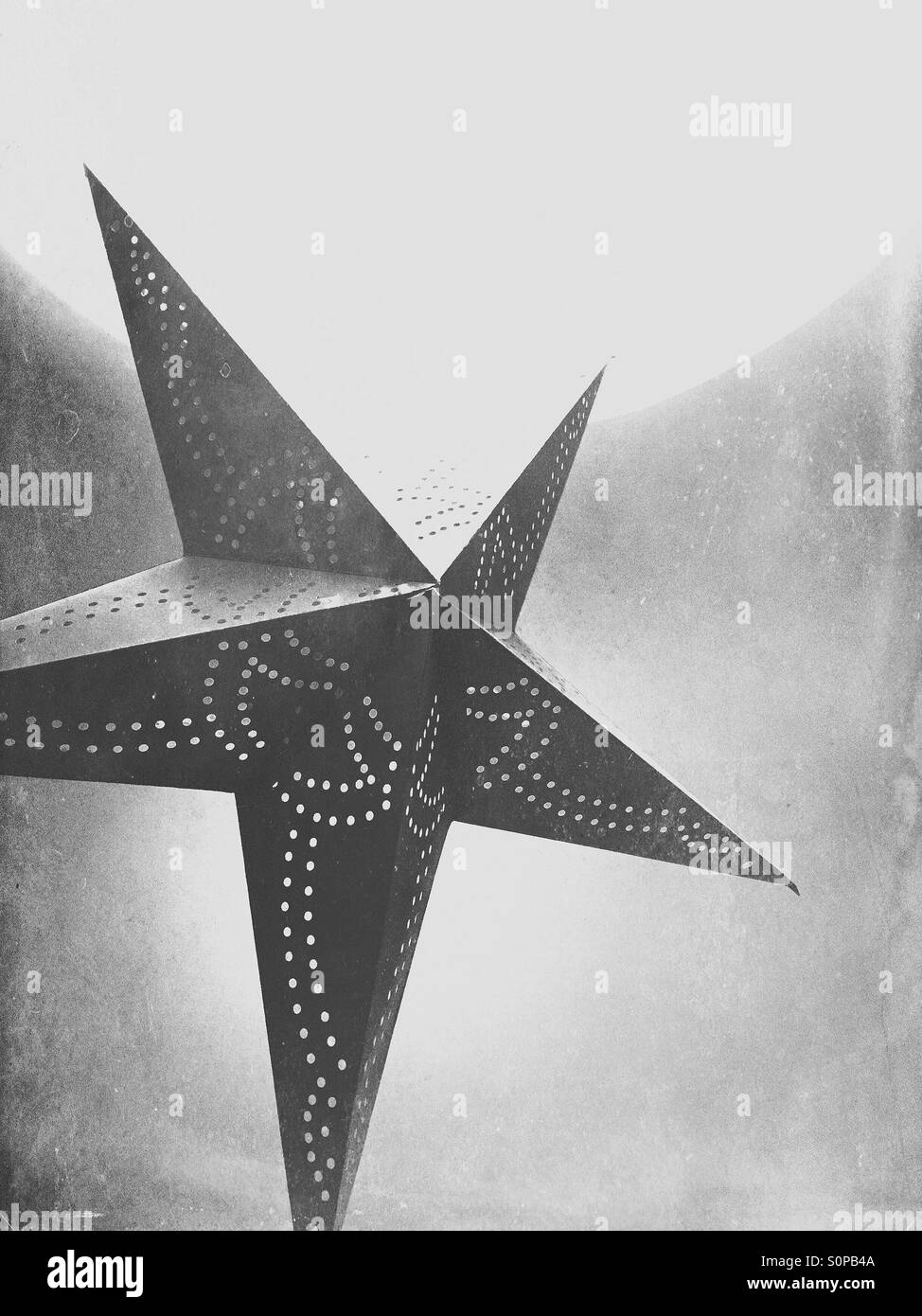 Red star. Christmas decoration hanging from a lamp - Smartphone Captured Stock Image