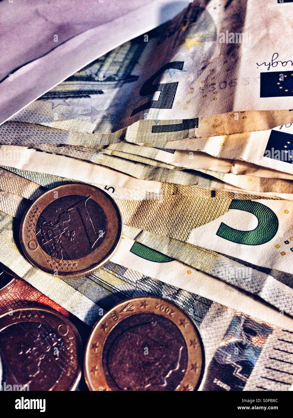 Small euro bills and coins - Smartphone Captured Stock Image