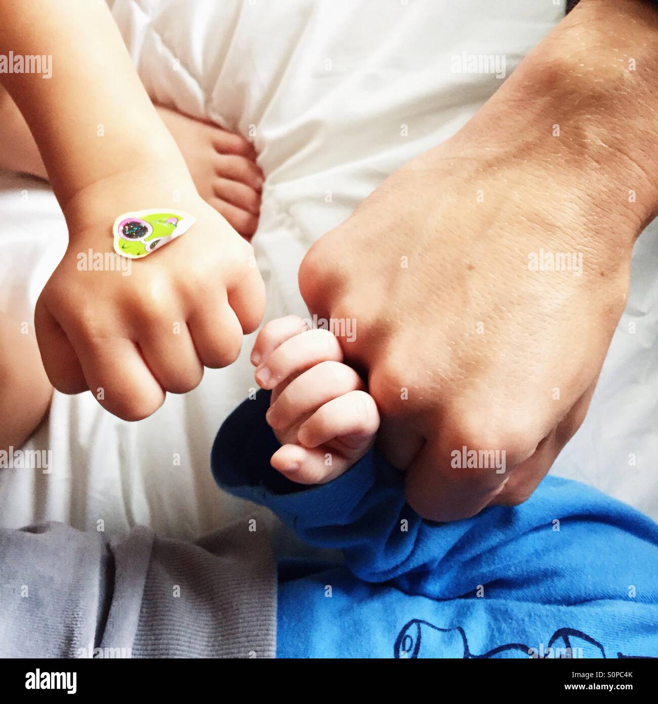 3 fists of father and two sons - family power Stock Photo