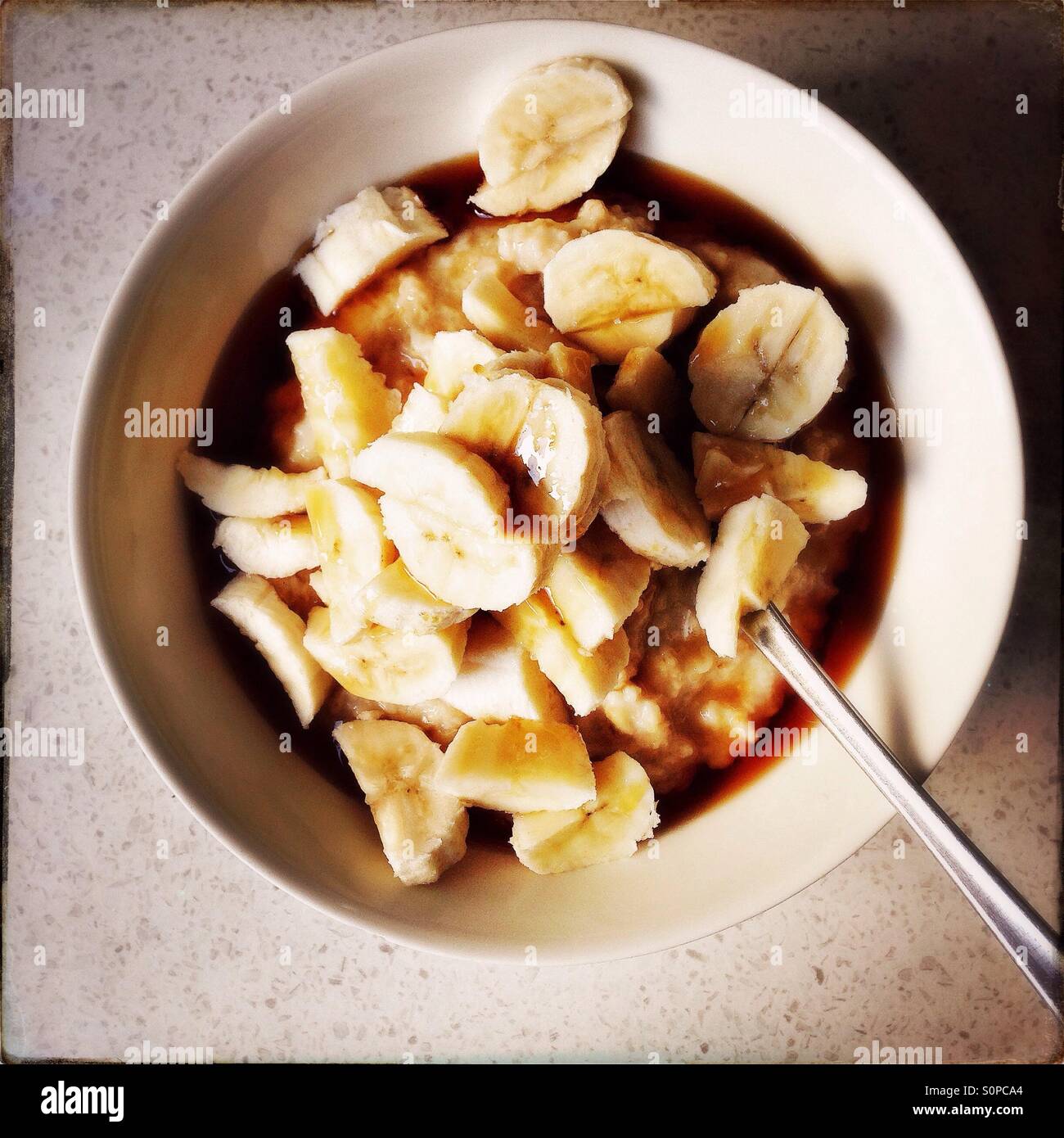 Porridge with maple syrup and fresh banana - Smartphone Captured Stock Image