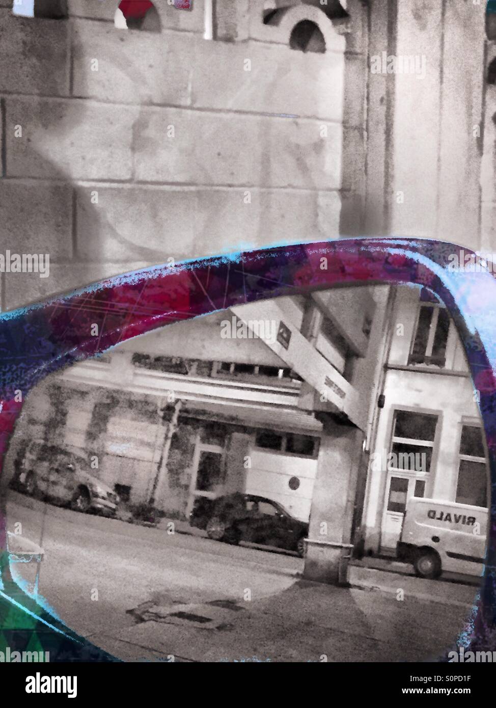 Building structures seen through a rear view mirror - Smartphone Captured Stock Image