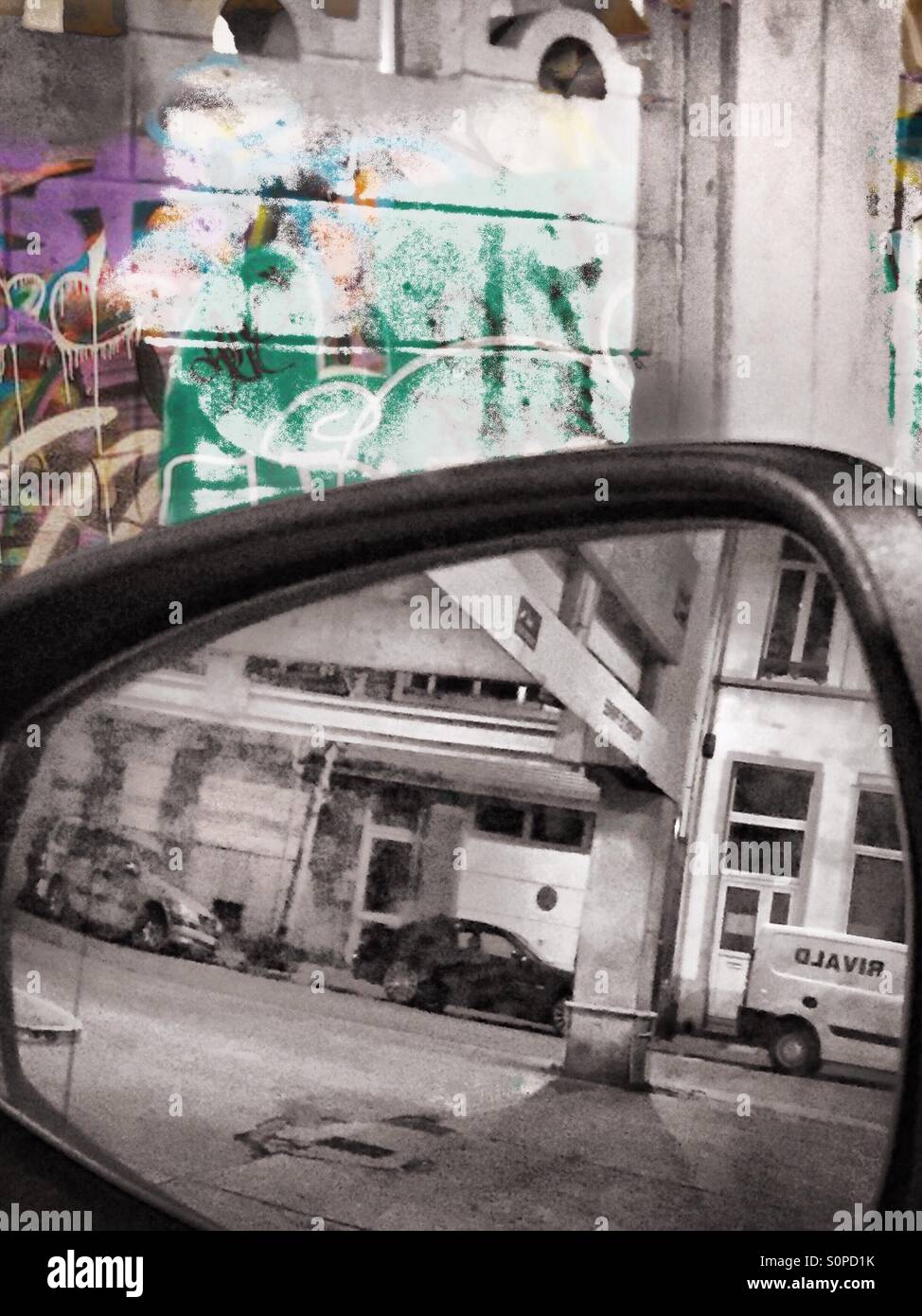 Building structures seen through a rear view mirror - Smartphone Captured Stock Image