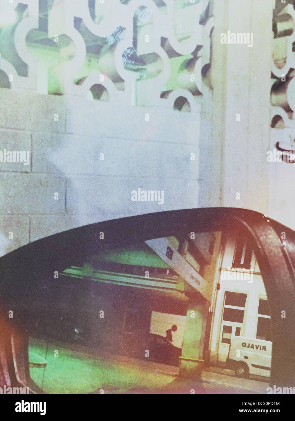 Building structures seen through a rear view mirror - Smartphone Captured Stock Image