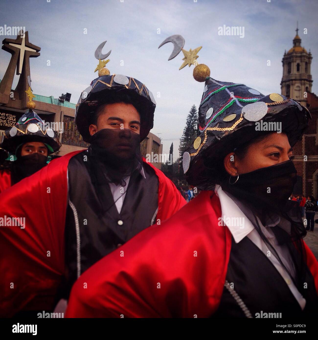 Dancers from Xocotlan, Puebla, perform the Moorish dance during the pilgrimage to the Basilica of Our Lady of Guadalupe, Mexico City, Mexico - Smartphone Captured Stock Image
