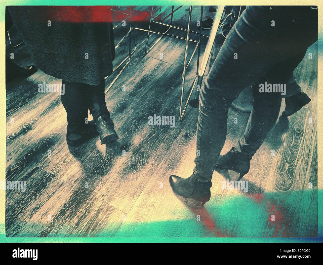 Social gathering on a wooden floor - Smartphone Captured Stock Image