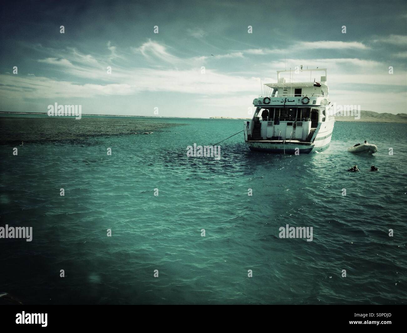 Diving boat with divers on Red Sea. - Smartphone Captured Stock Image