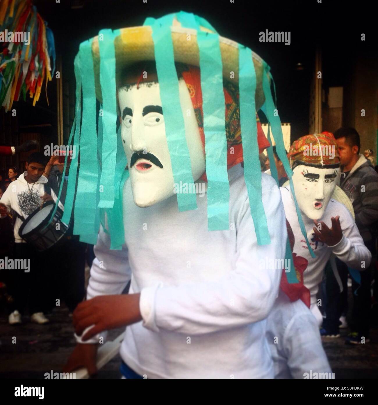 Dancers from El Palmar, Puebla, perform the Danza de los Viejitos (Dance of the Elderly) during the pilgrimage to the Basilica of Our Lady of Guadalupe, Mexico City, Mexico - Smartphone Captured Stock Image