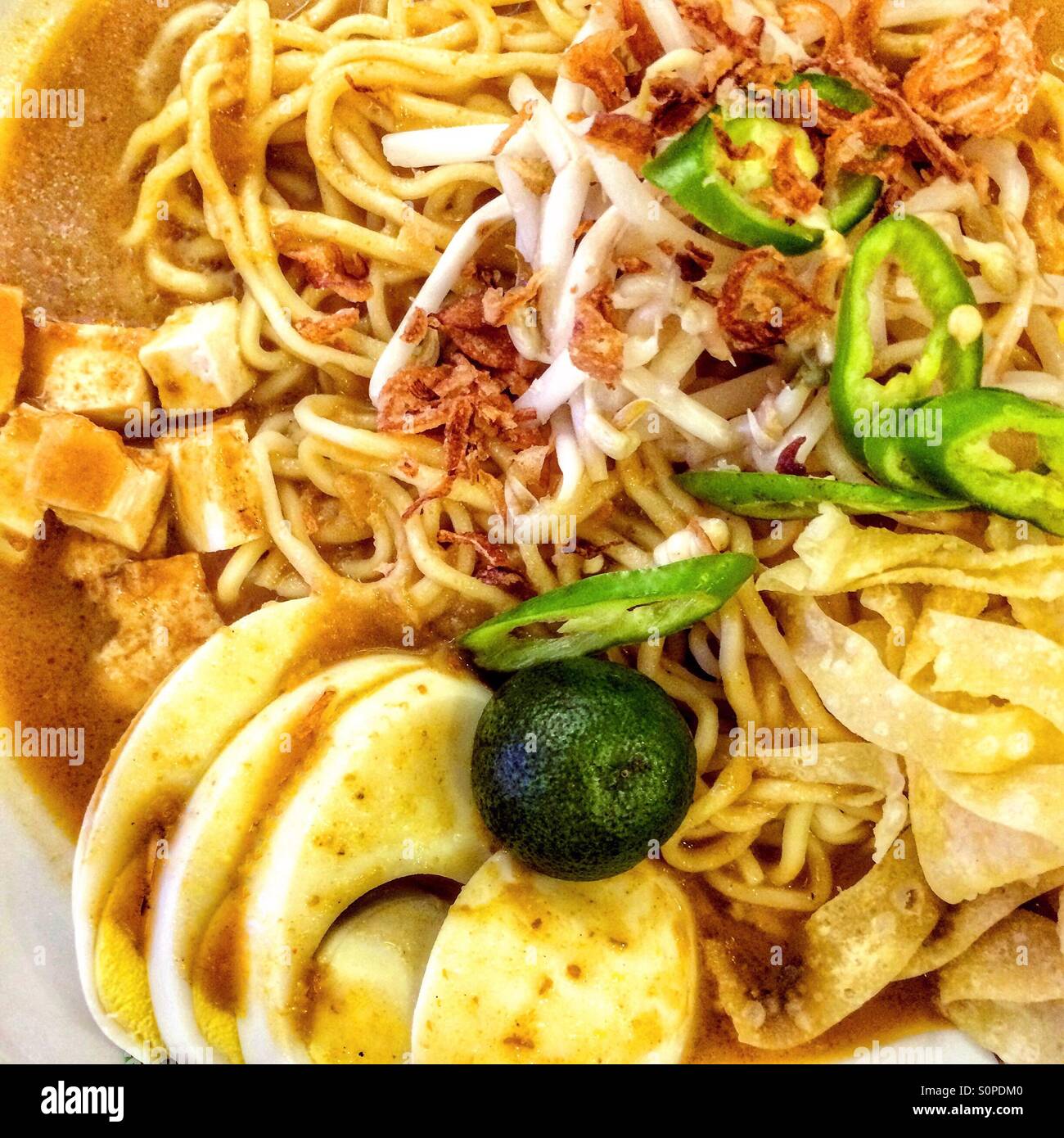 Malaysian noodles in sweet potato gravy mee rebus - Smartphone Captured Stock Image