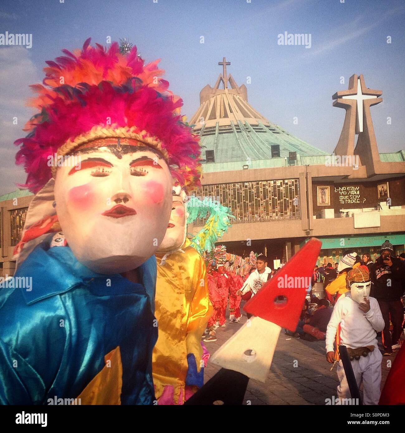 Dancers from El Palmar, Puebla, perform the Danza de los Viejitos during the pilgrimage to the Basilica of Our Lady of Guadalupe, Mexico City, Mexico - Smartphone Captured Stock Image