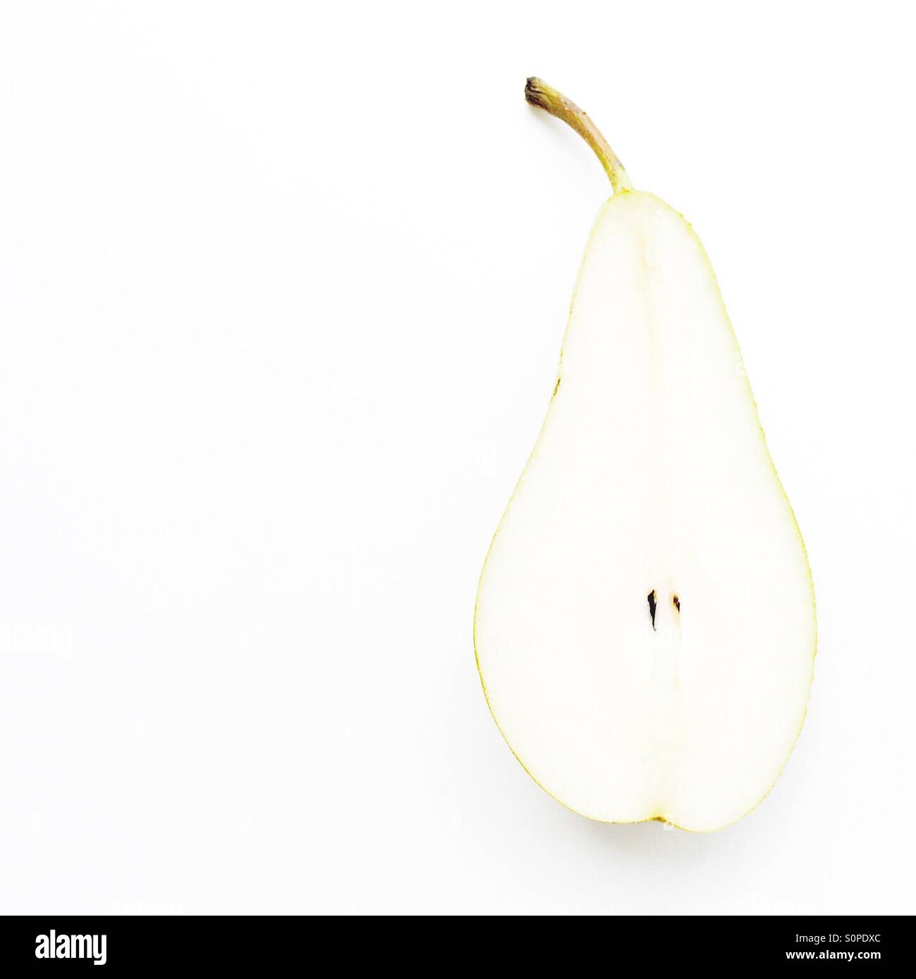 Minimalist image of a Pear cut in half Stock Photo