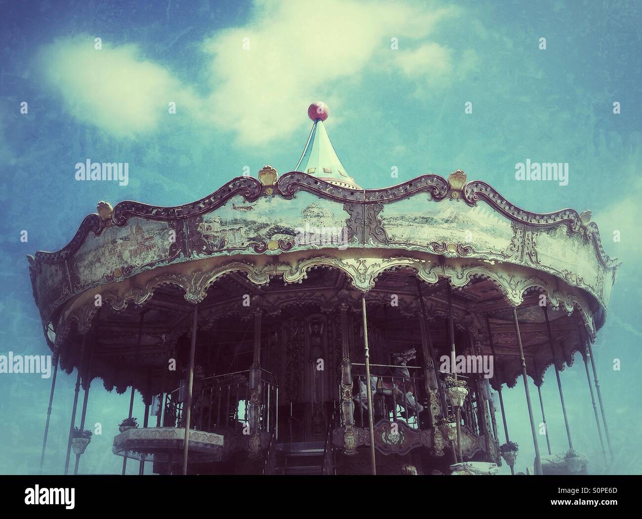 Old carousel in the amusement park Stock Photo