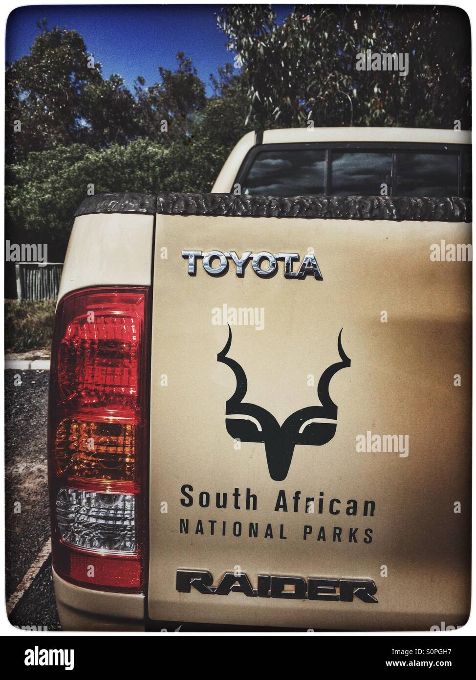 Vehicle with South African National Parks logo on back. - Smartphone Captured Stock Image