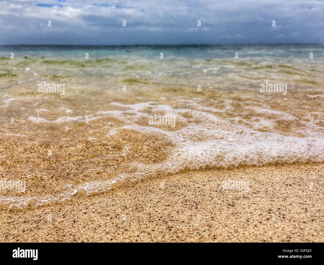 Incoming tide close up of sea water - Smartphone Captured Stock Image