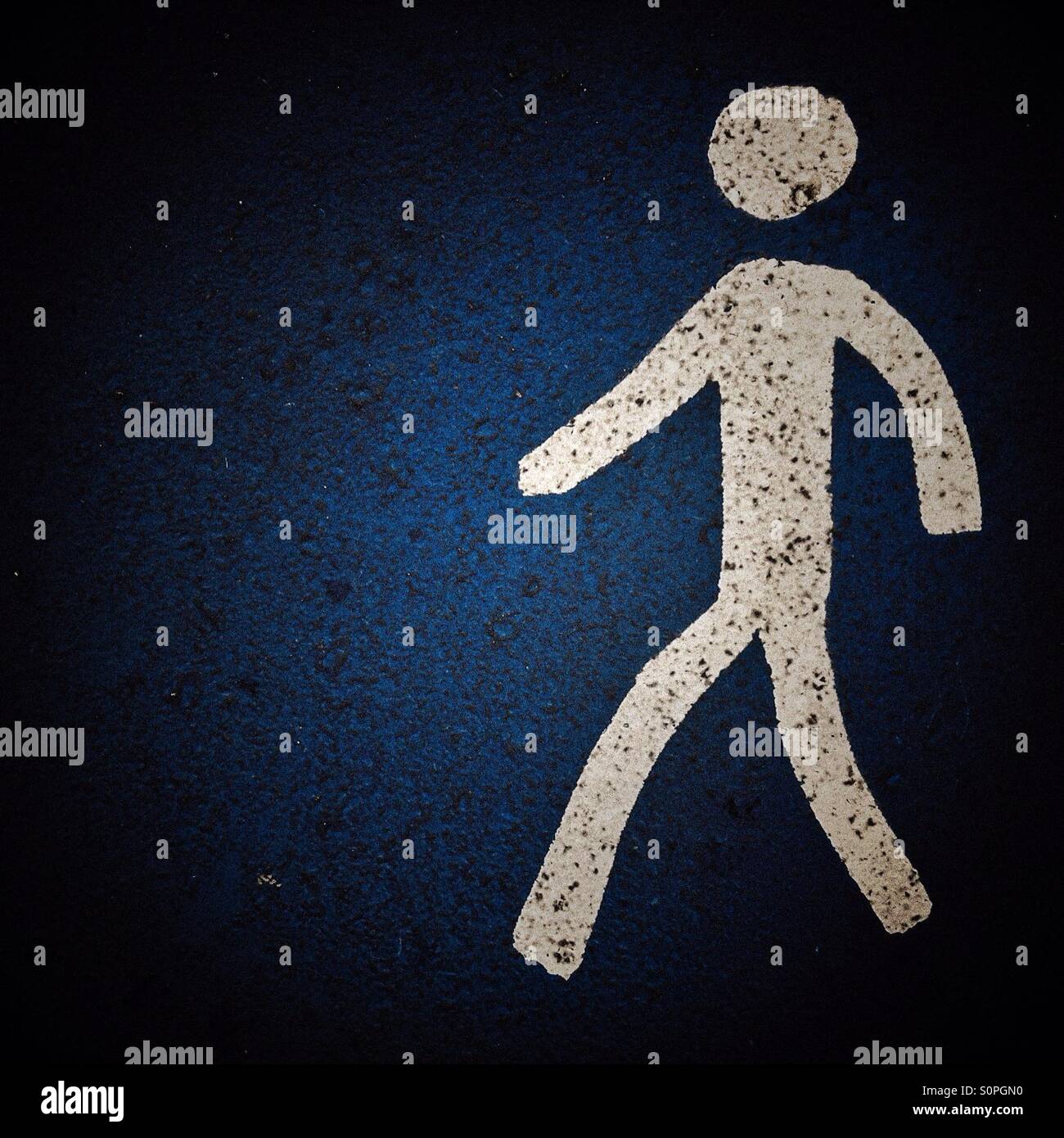 Pedestrian sign on blue background - Smartphone Captured Stock Image