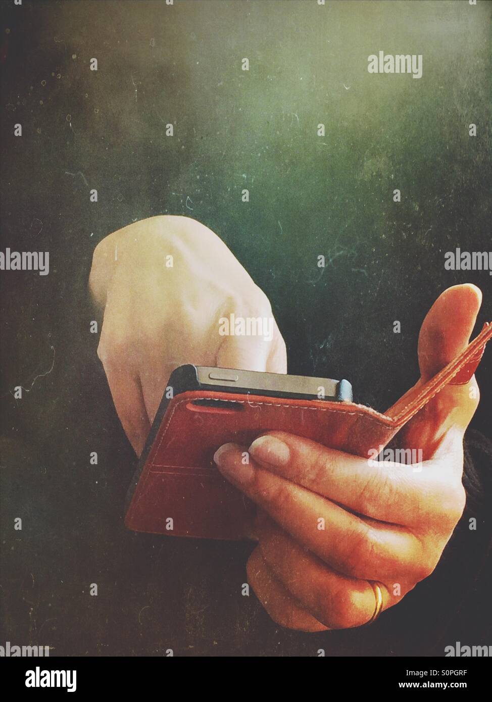 Closeup of the hands of a woman using a smartphone - Smartphone Captured Stock Image